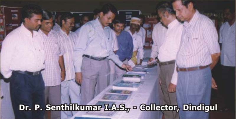 Dr. P. Senthilkumar IAS, Collector of Dindigul, viewing the Coodu Trust exhibition